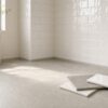 Floor tiles vs wall tiles shown together in a modern bathroom with matte floor and glossy wall