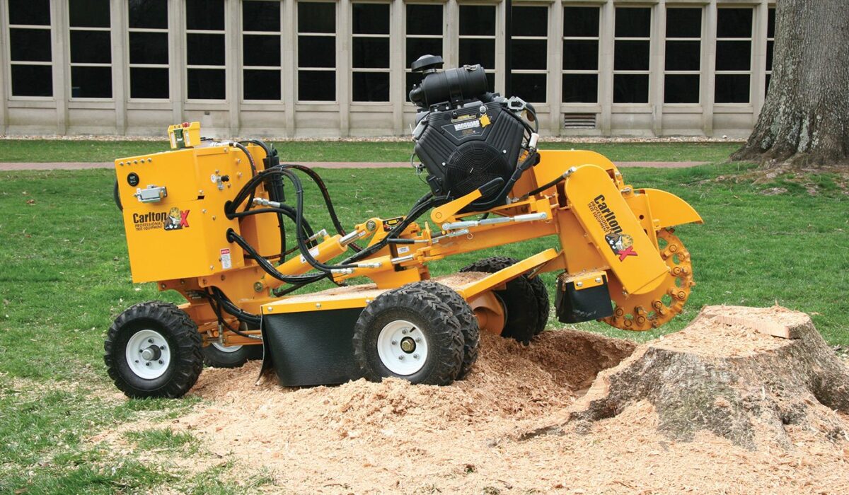 Stump grinding cost in Melbourne showing a professional removing a tree stump with a stump grinder